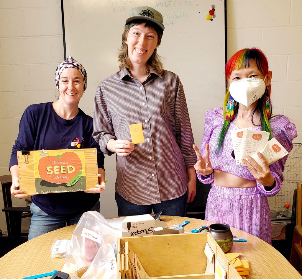 Three people in the image from Seed Library Workshop