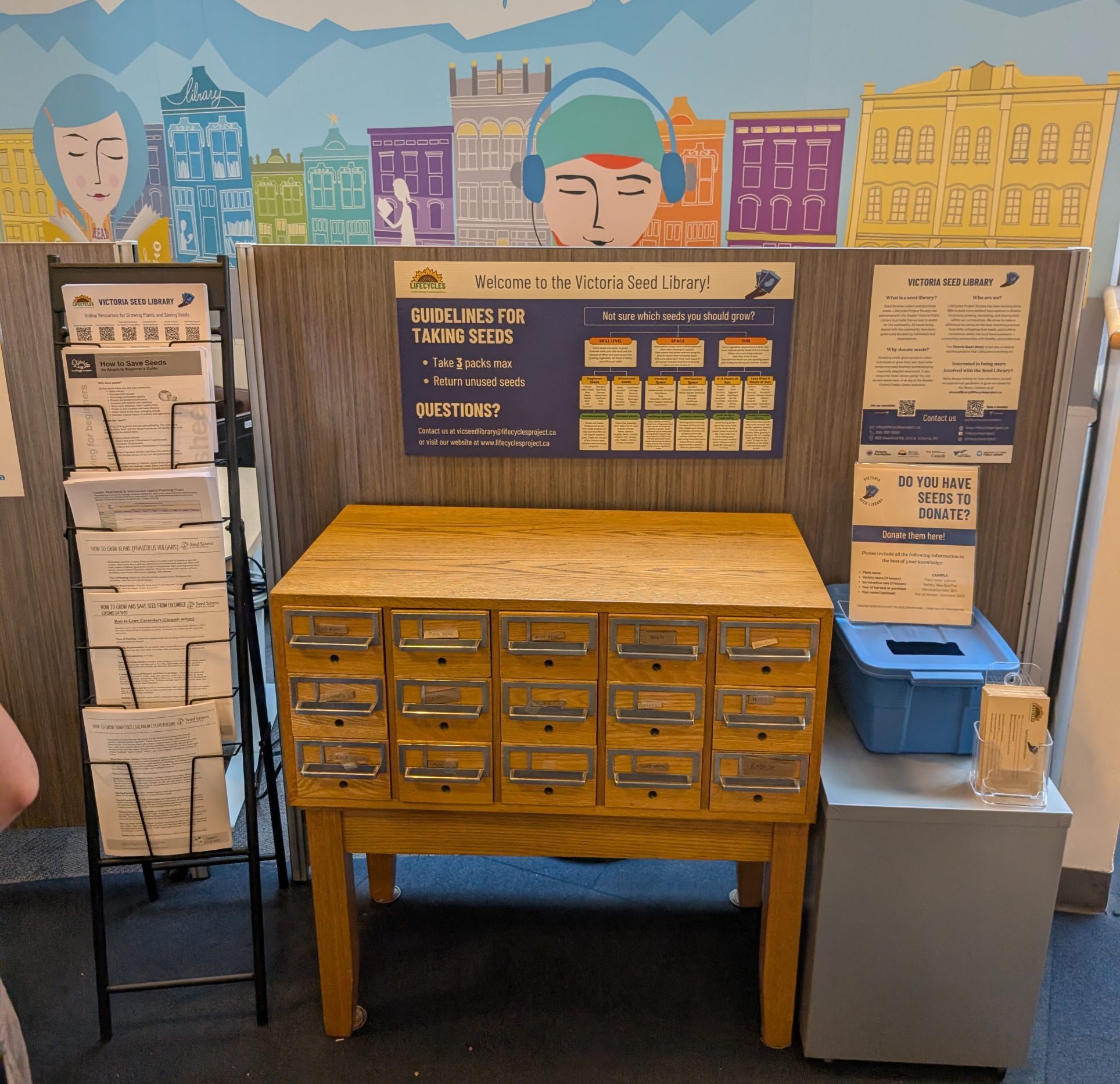 Wooden card catalogue cabinet of labelled seed drawers at the Victoria Seed Library display.